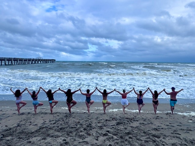 Wellness retreat group on the beach